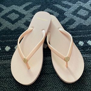 Pale pink Tory Burch flip flops